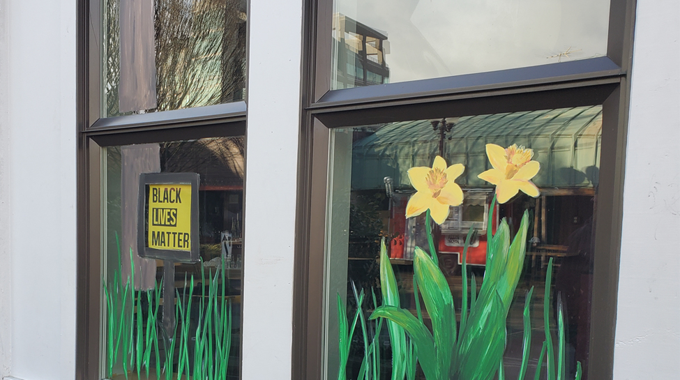 Black lives matter painting on a business window