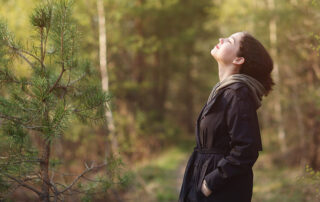 Woman finds peace walking in the woods